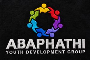 Embroidered ABAPHATHI Youth Development Group logo on black T-shirt